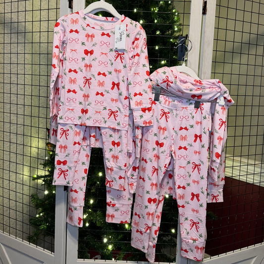 Perfectly Wrapped set hanging in front of a Christmas tree