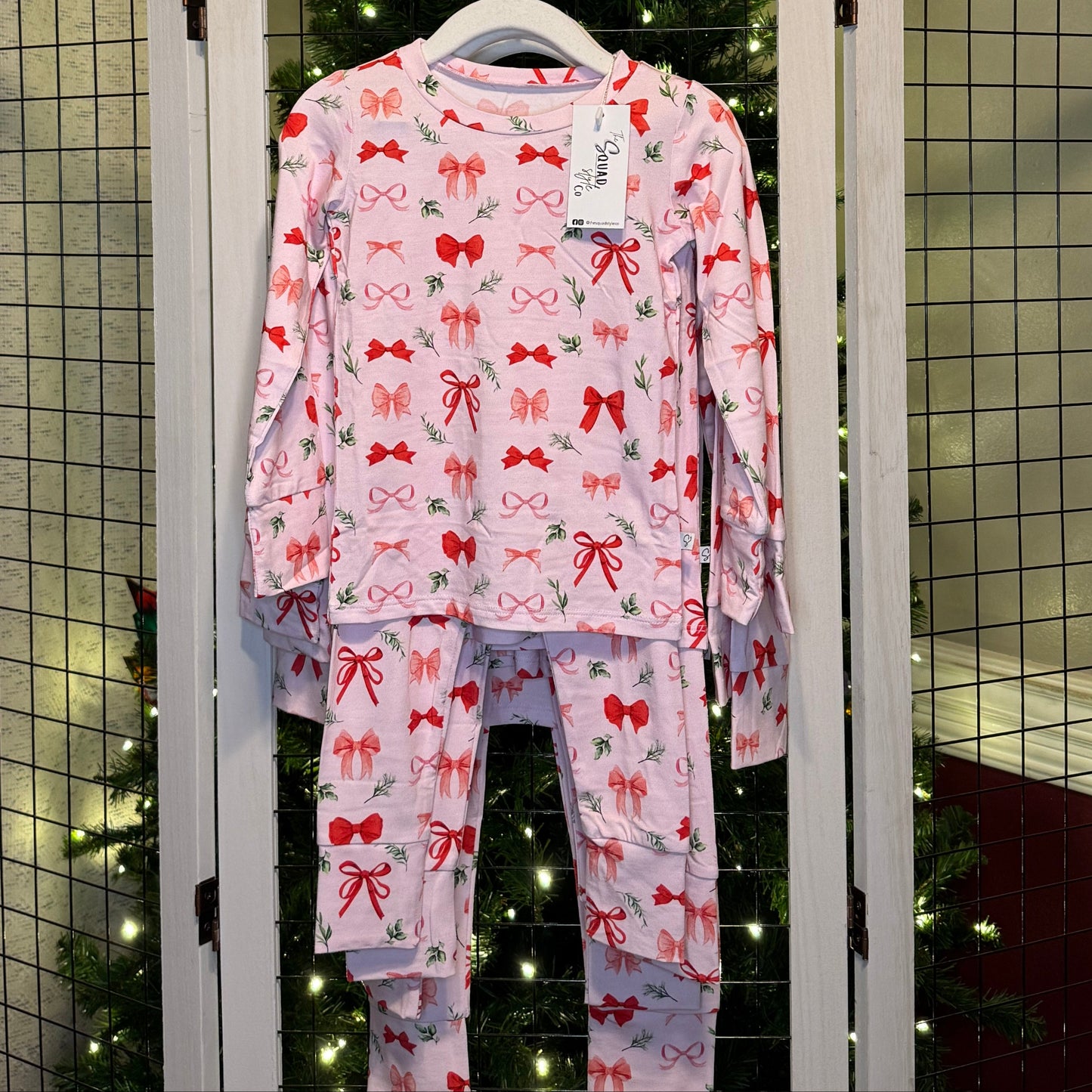 Perfectly Wrapped set hanging in front of a Christmas tree