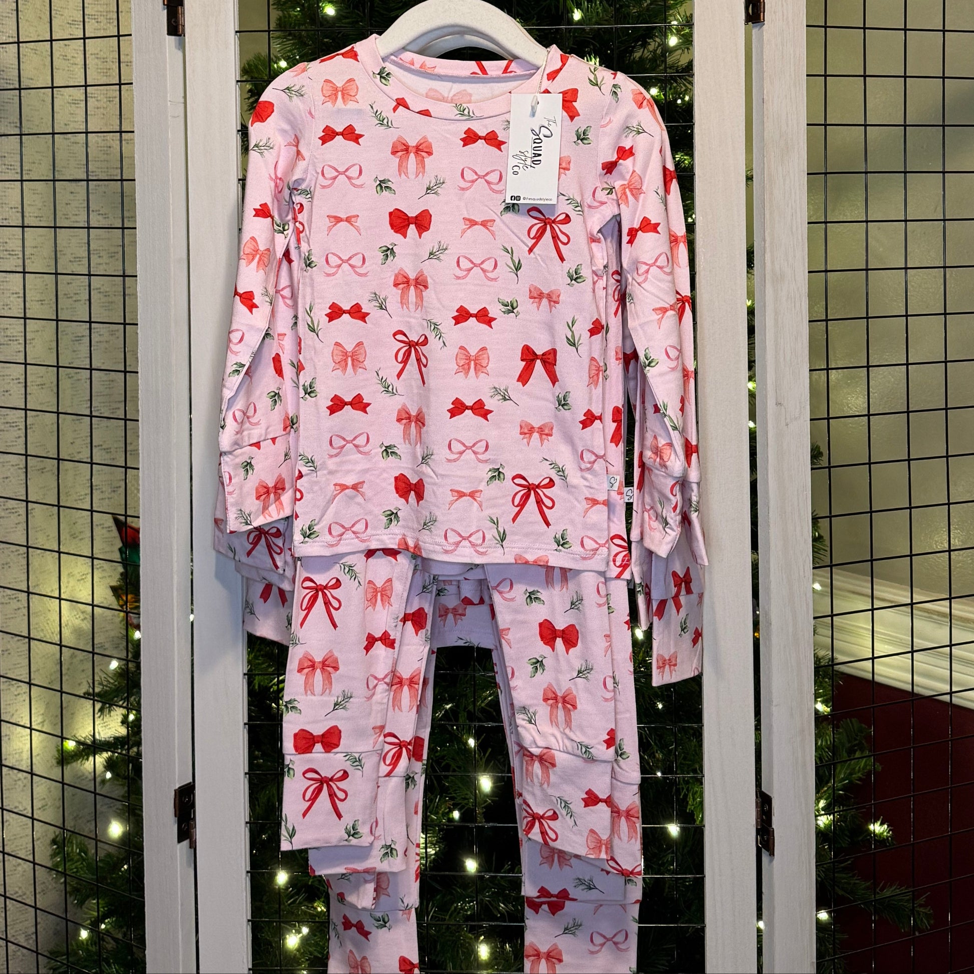 Perfectly Wrapped set hanging in front of a Christmas tree