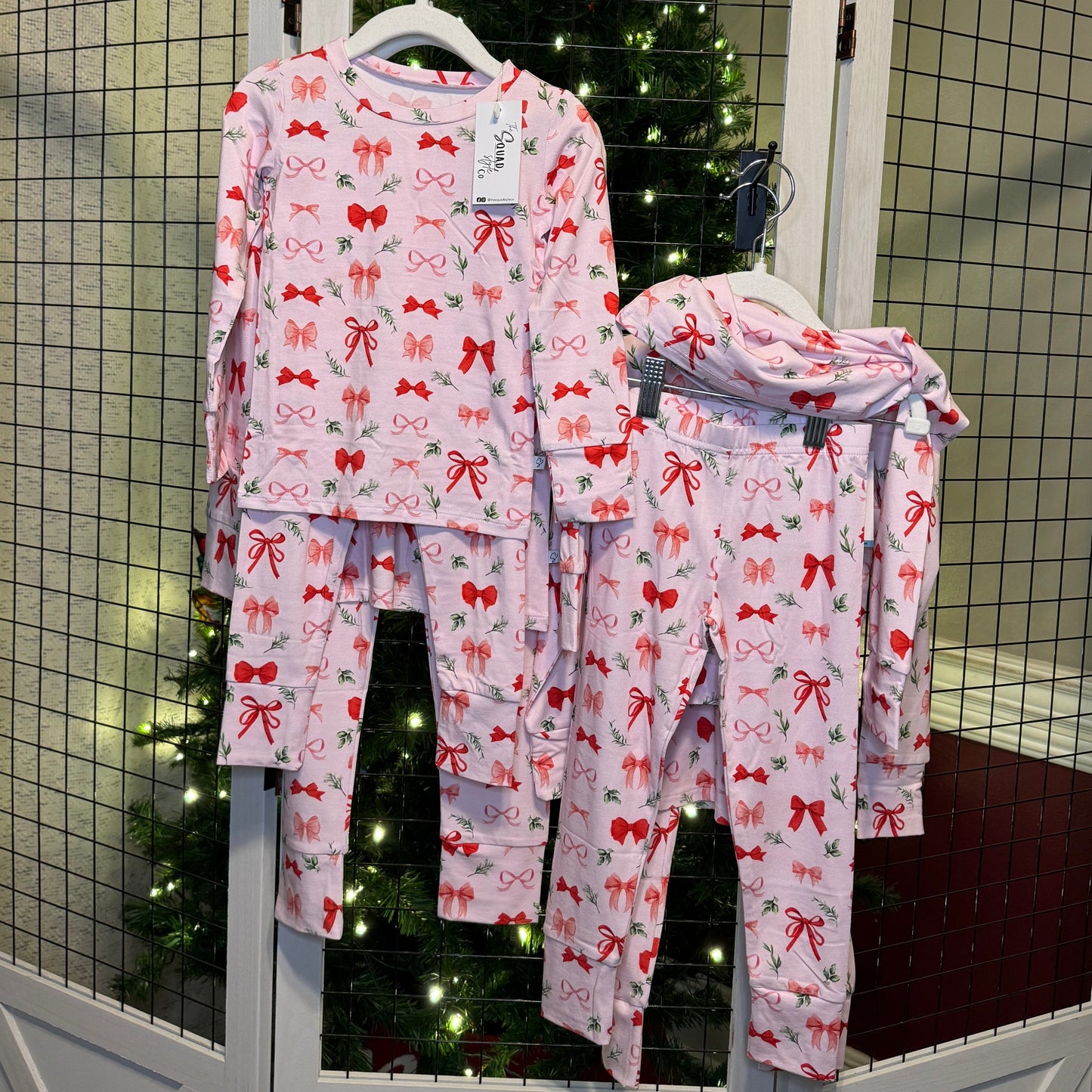 Perfectly Wrapped set hanging in front of a Christmas tree