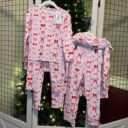 Perfectly Wrapped set hanging in front of a Christmas tree