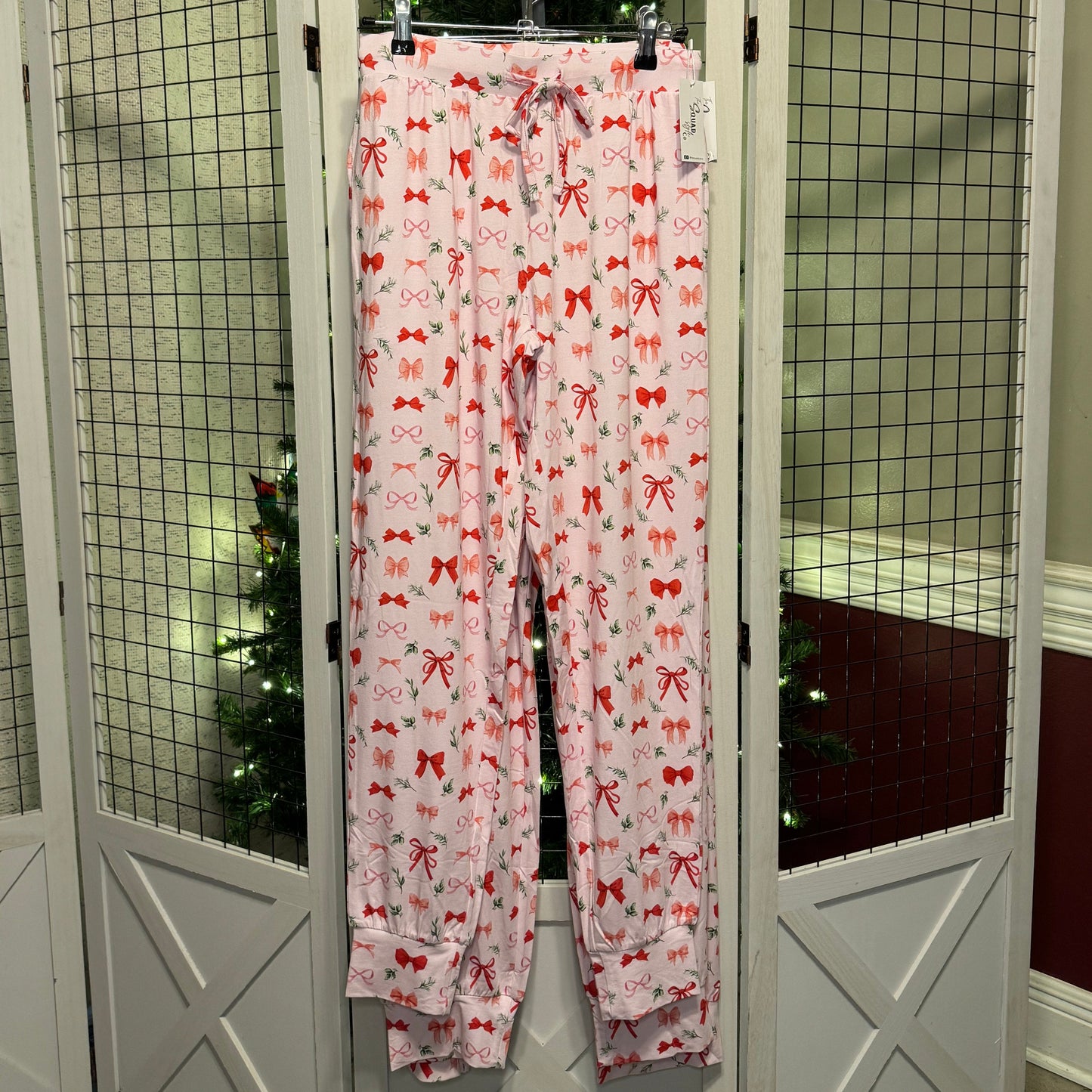 Perfectly Wrapped joggers in front of a Christmas tree