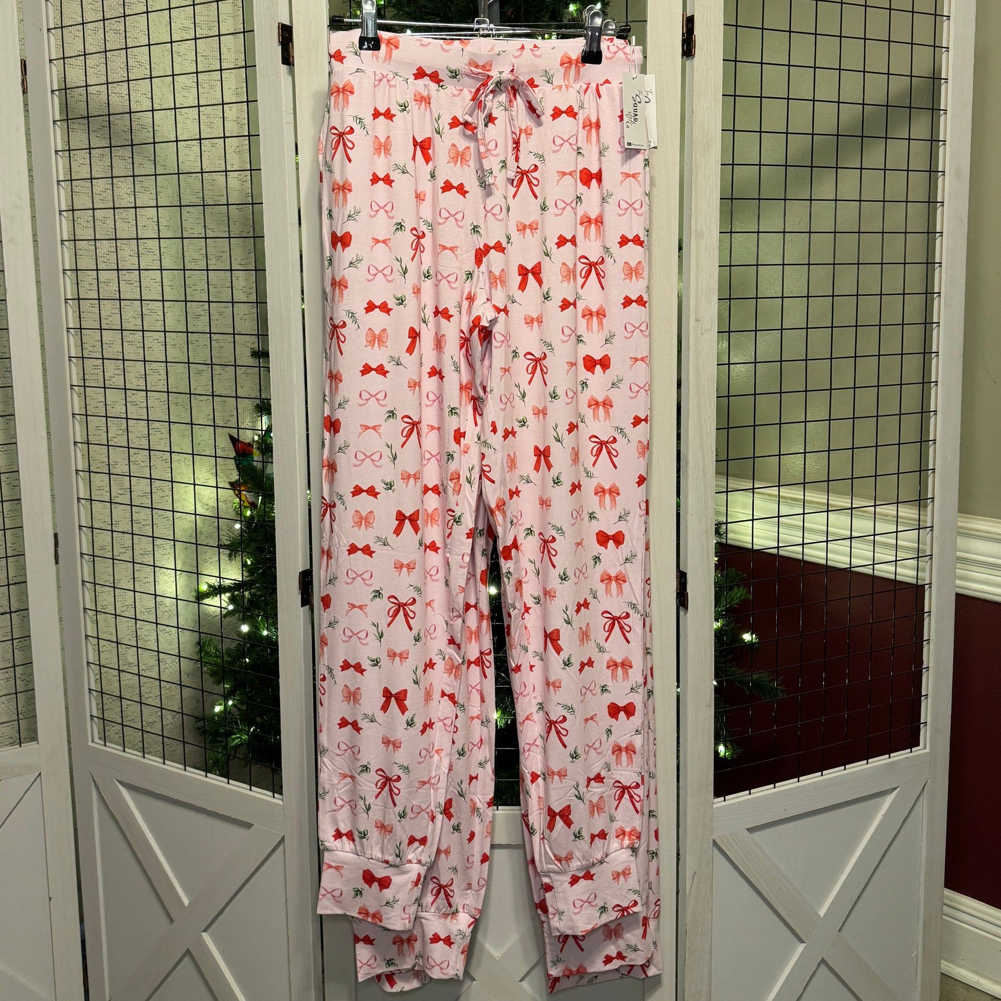 Perfectly Wrapped joggers in front of a Christmas tree