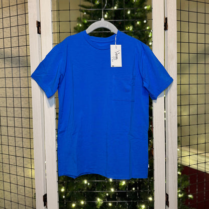 Blue t-shirt hanging with a Christmas tree in the background